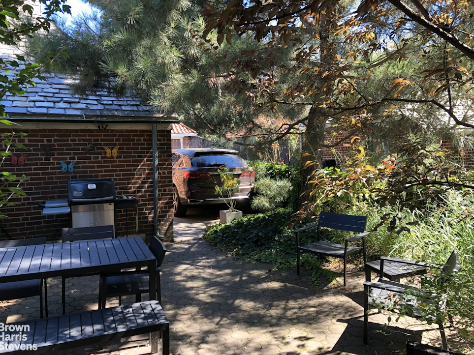 34-27 87th Street Queens, NY 11372 - Photo 17 of 19 a view of an outdoor sitting area with brick walls