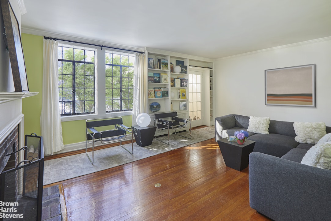 34-27 87th Street Queens, NY 11372 - Photo 3 of 19 a living room with furniture and a wooden floor