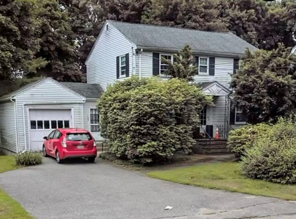 394 Marrett Road Lexington, MA 02421 - Photo 1 of 1 a front view of a house with a garden