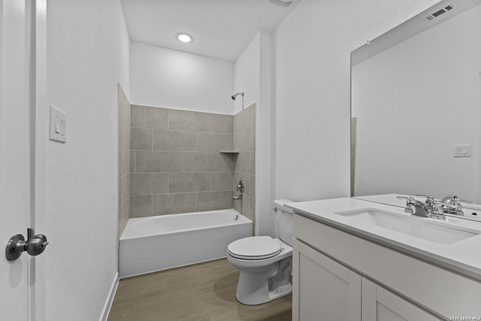 2299 Fort Davis Pass Marion, TX 78124 - Photo 12 of 26 a bathroom with a granite countertop toilet a sink and a bathtub