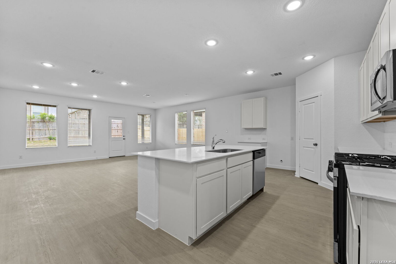 2299 Fort Davis Pass Marion, TX 78124 - Photo 15 of 26 a large kitchen with stainless steel appliances granite countertop a lot of counter space and a window