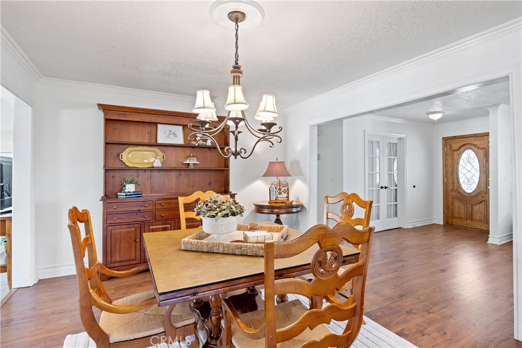 3527 Bluff Street Norco, CA 92860 - Photo 11 of 53 a view of a dining room with furniture and wooden floor
