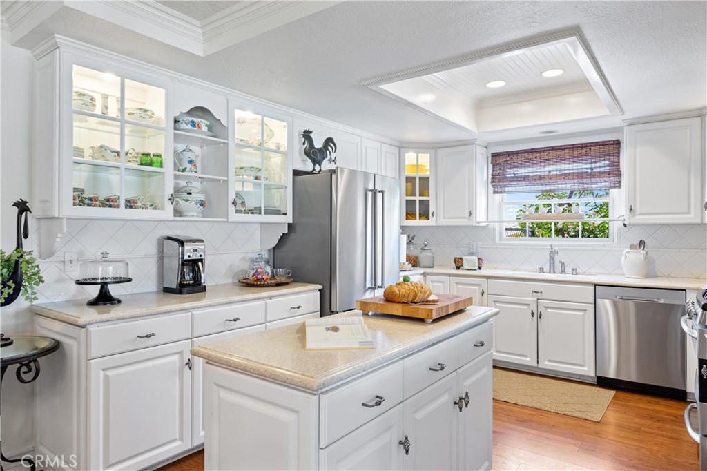 3527 Bluff Street Norco, CA 92860 - Photo 12 of 53 a kitchen with a sink a window and cabinets