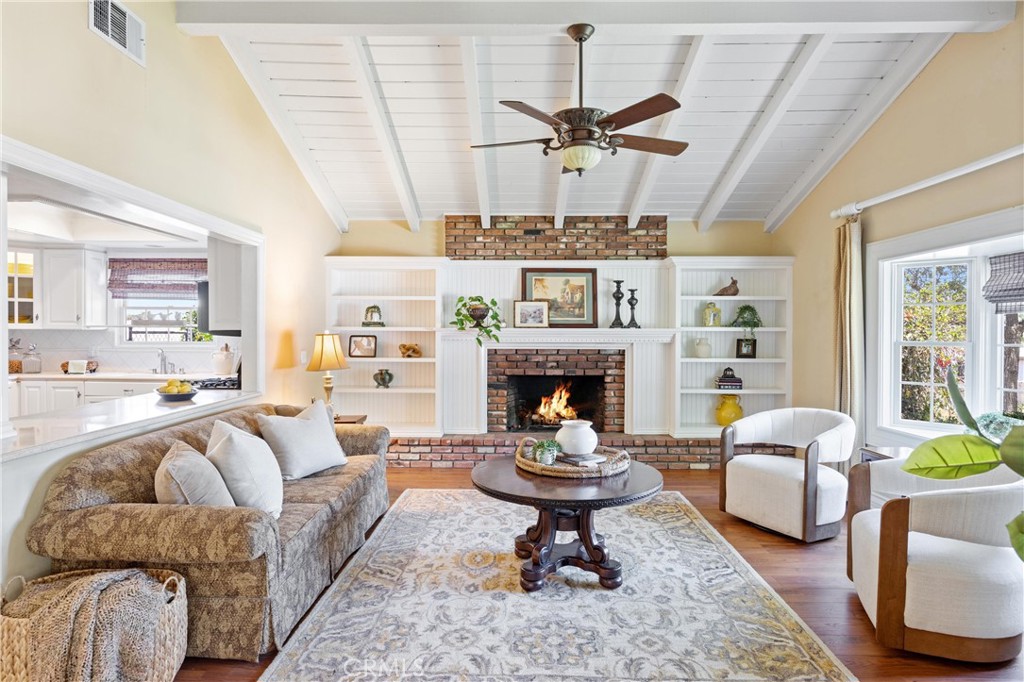 3527 Bluff Street Norco, CA 92860 - Photo 19 of 53 a living room with furniture and a fireplace