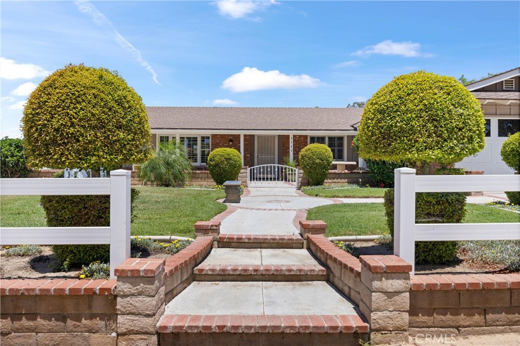 3527 Bluff Street Norco, CA 92860 - Photo 2 of 53 a front view of a house with garden