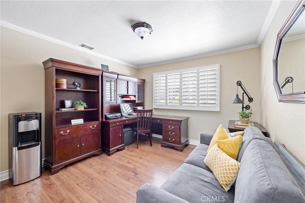 3527 Bluff Street Norco, CA 92860 - Photo 28 of 53 a living room with furniture and a window