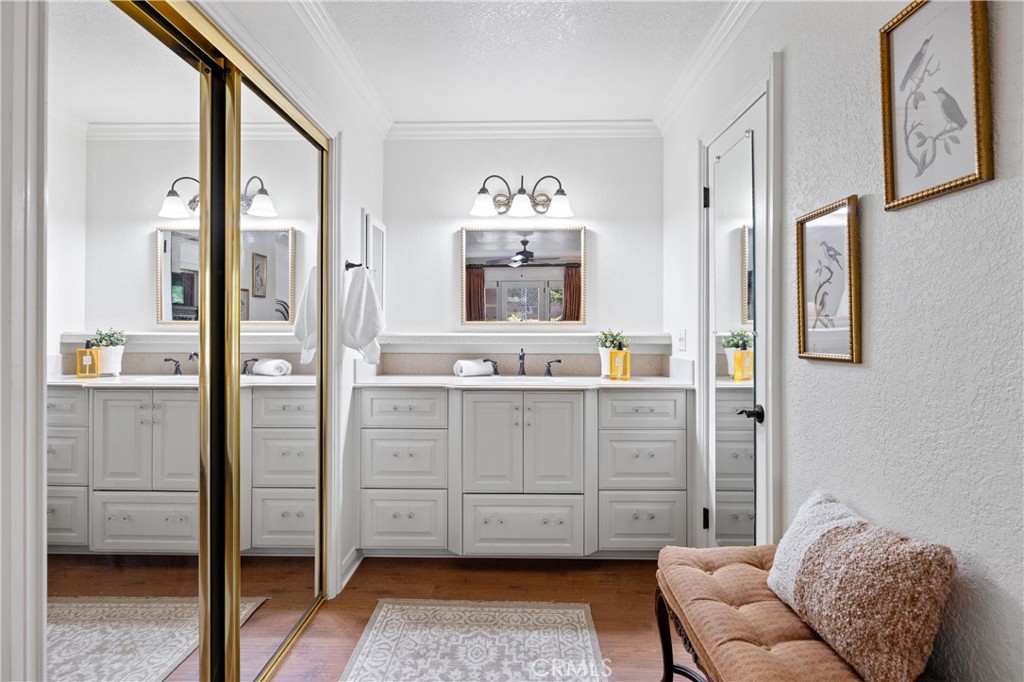 3527 Bluff Street Norco, CA 92860 - Photo 32 of 53 a bathroom with a granite countertop sink mirror and a