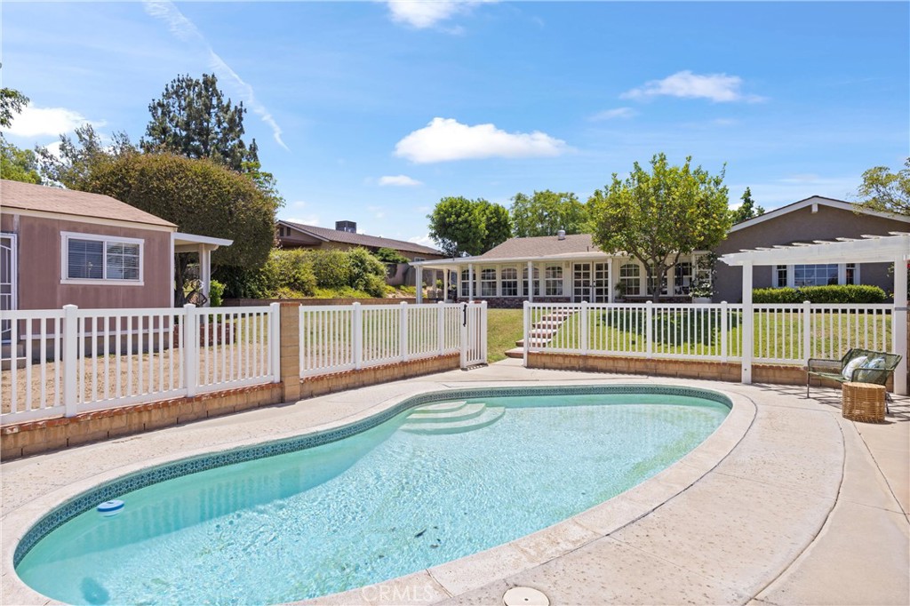 3527 Bluff Street Norco, CA 92860 - Photo 38 of 53 a view of a house with a swimming pool