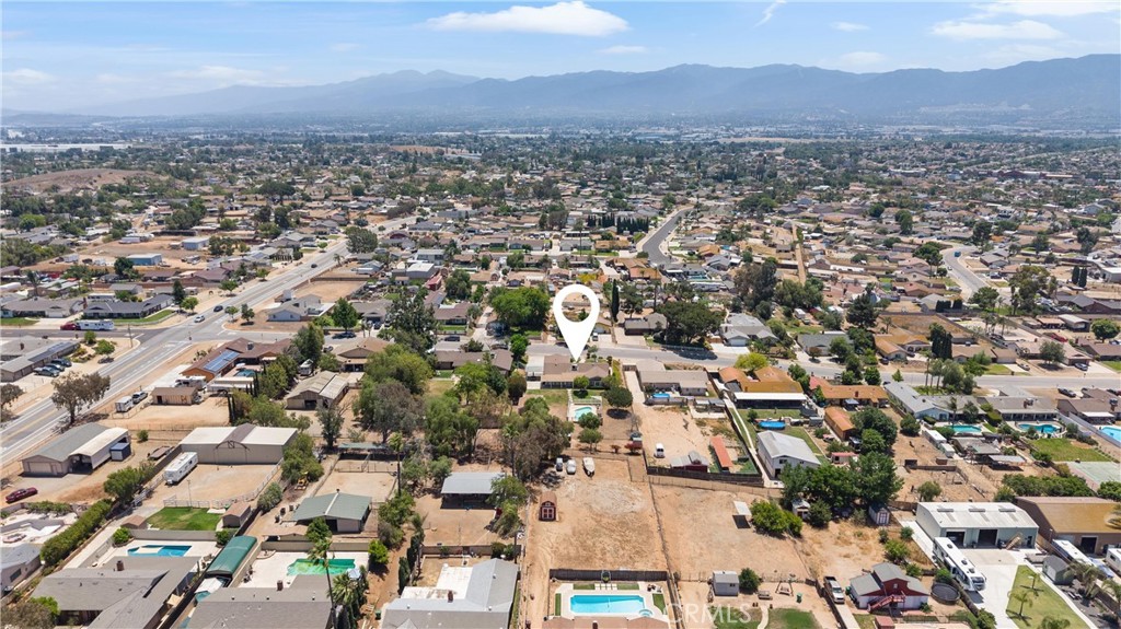 3527 Bluff Street Norco, CA 92860 - Photo 50 of 53 an aerial view of residential houses with outdoor space and trees