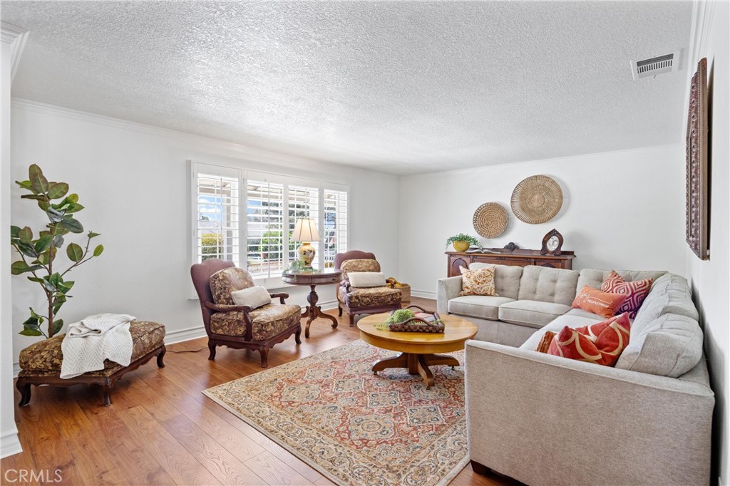 3527 Bluff Street Norco, CA 92860 - Photo 7 of 53 a living room with furniture and a window