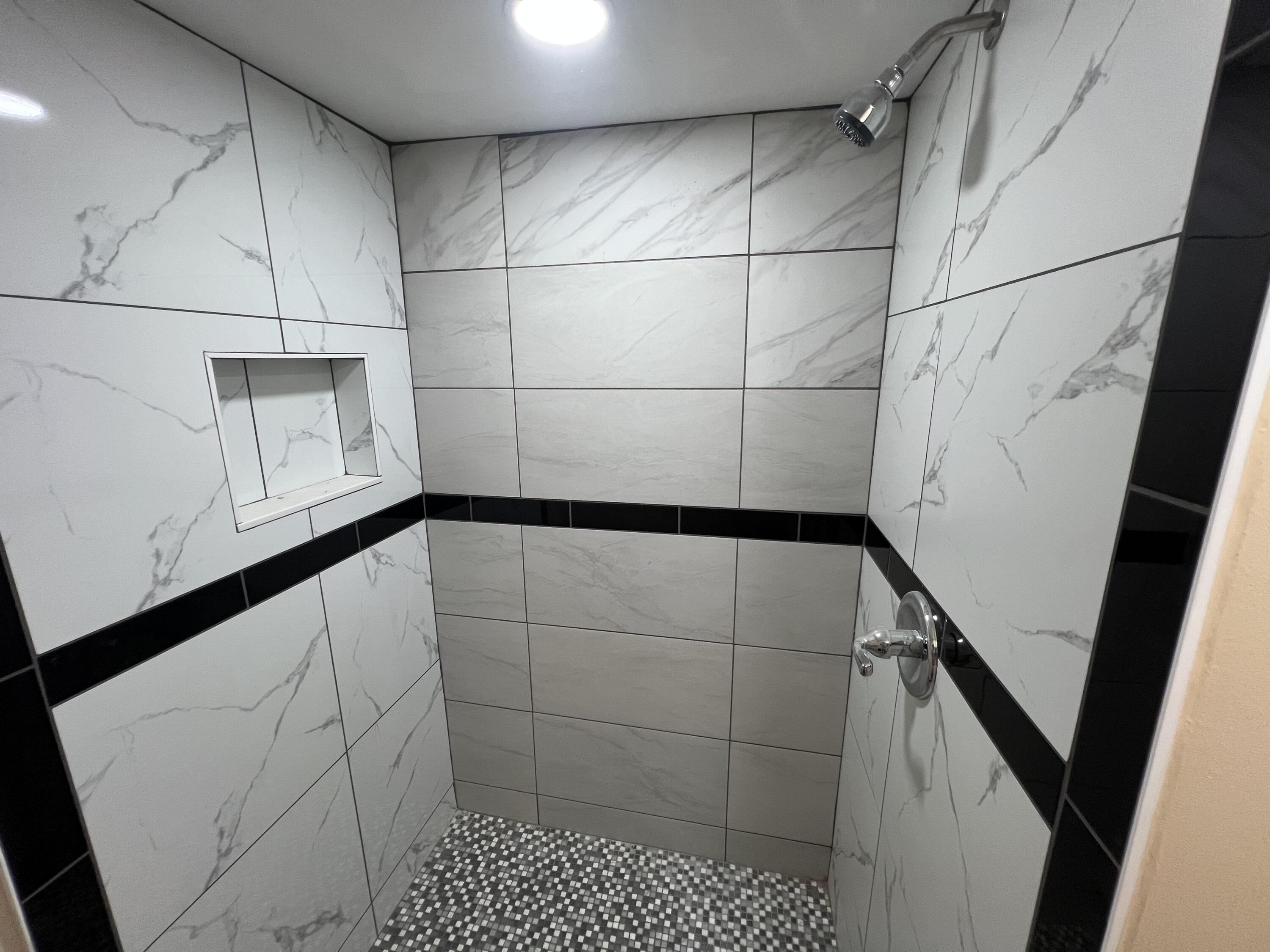 5728 St Lucie Boulevard, Unit REAR HOUSE Fort Pierce, FL 34946 - Photo 20 of 22 a bathroom with a shower