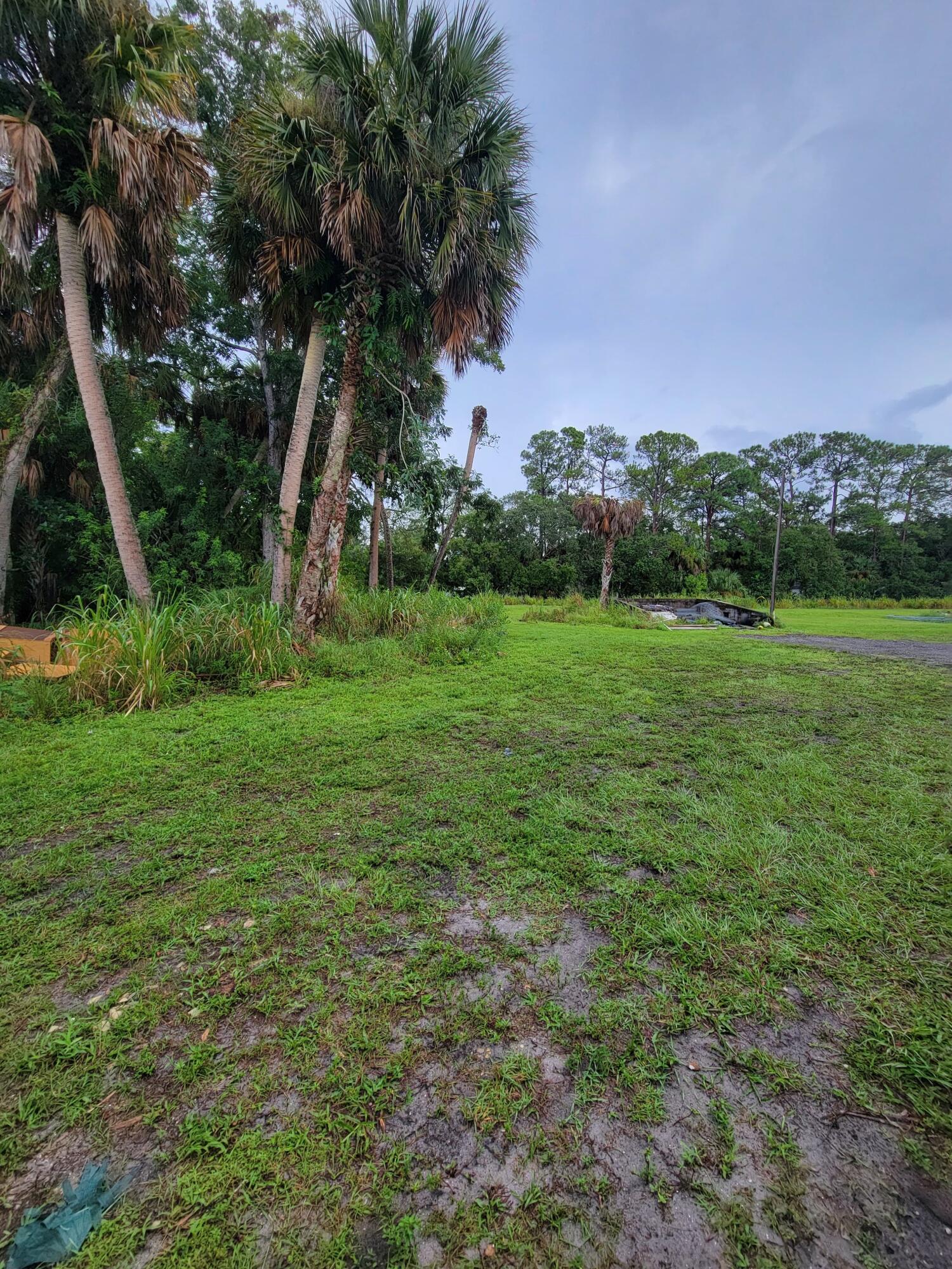 5728 St Lucie Boulevard, Unit REAR HOUSE Fort Pierce, FL 34946 - Photo 4 of 22 a view of a lush green space