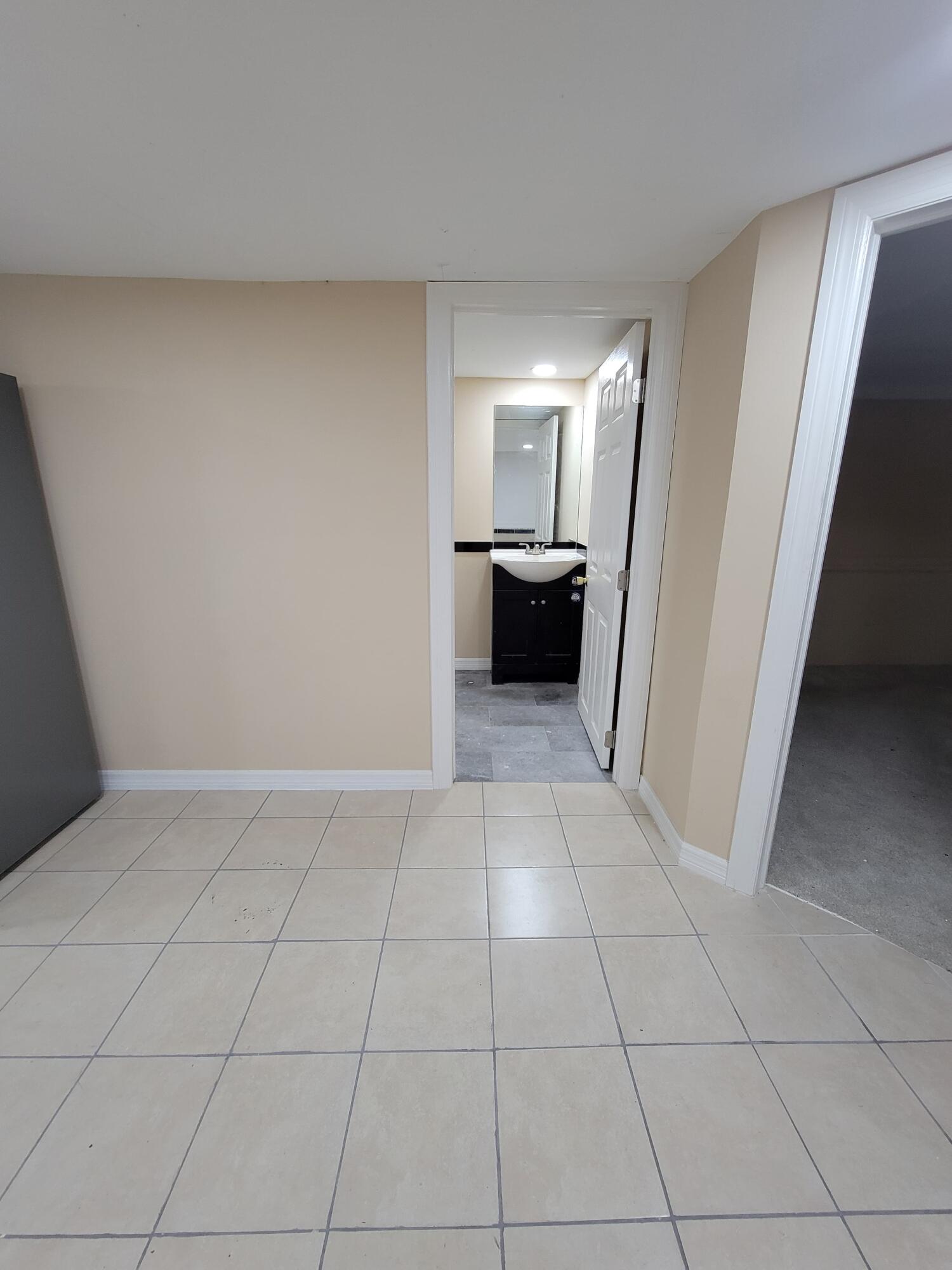 5728 St Lucie Boulevard, Unit REAR HOUSE Fort Pierce, FL 34946 - Photo 8 of 22 a view of an empty room and fire place