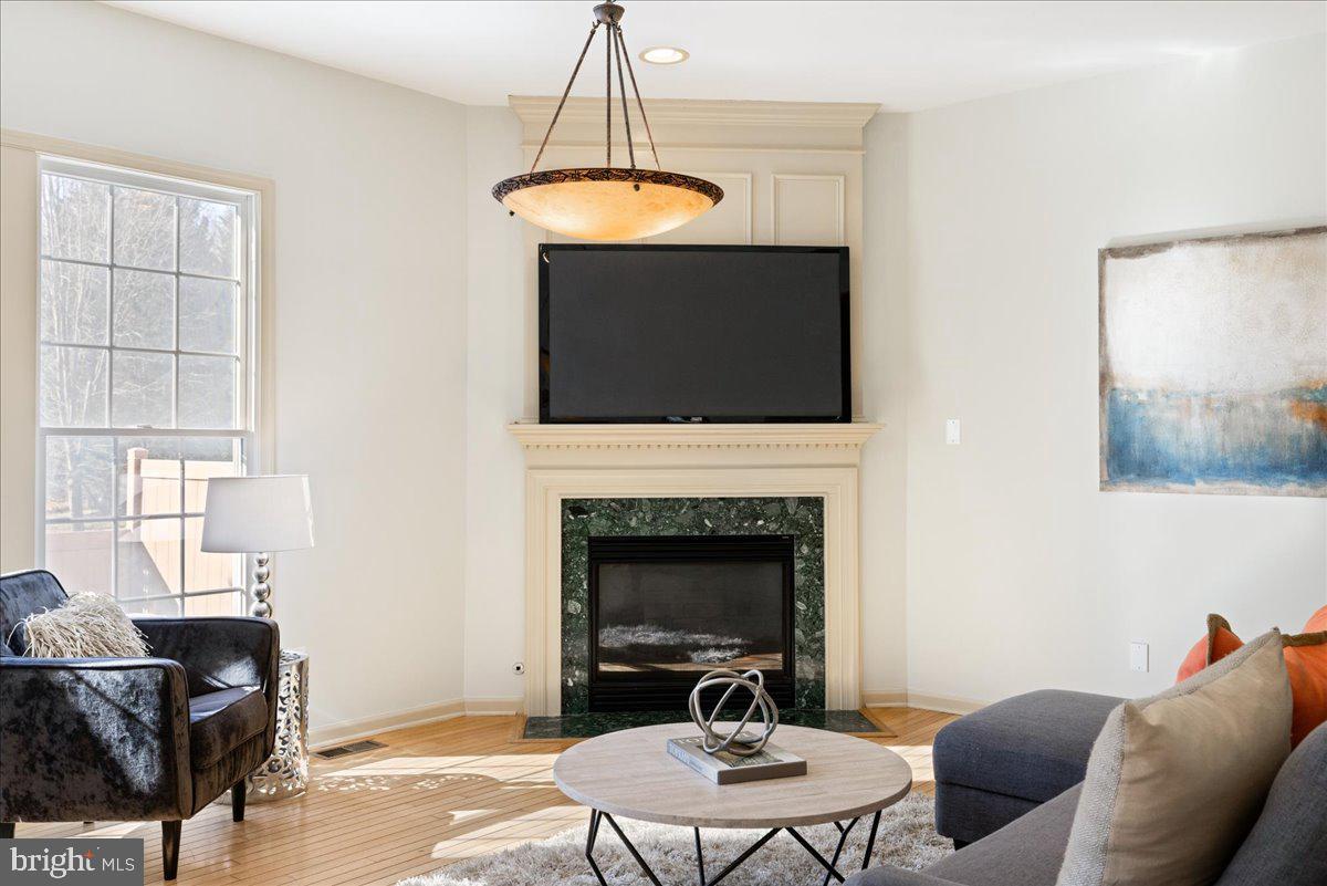 22 Maidenhead Road Princeton, NJ 08540 - Photo 10 of 31 a living room with furniture a fireplace and a flat screen tv