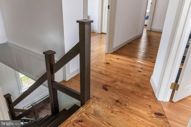 a bedroom with a bed and a mirror