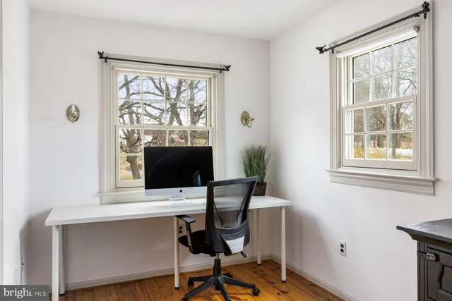 a bedroom with a bed and a television in it