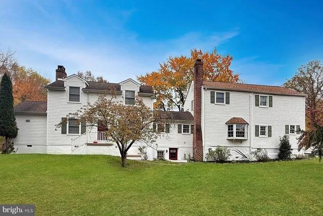 an aerial view of a house with garden space and street view