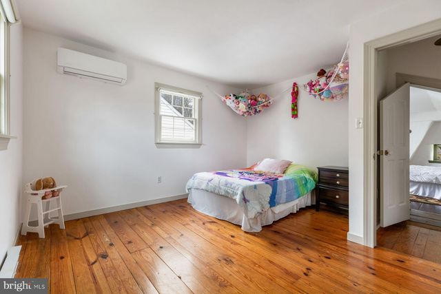 a view of a storage and utility room with washer and dryer