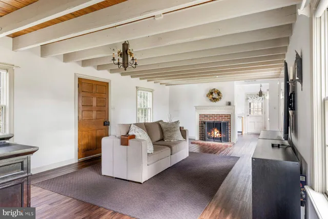 a view of an entryway with wooden floor