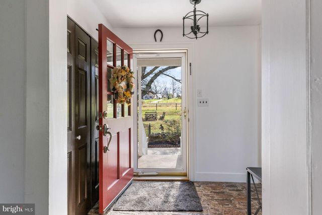 a kitchen with stainless steel appliances a stove a sink and a microwave