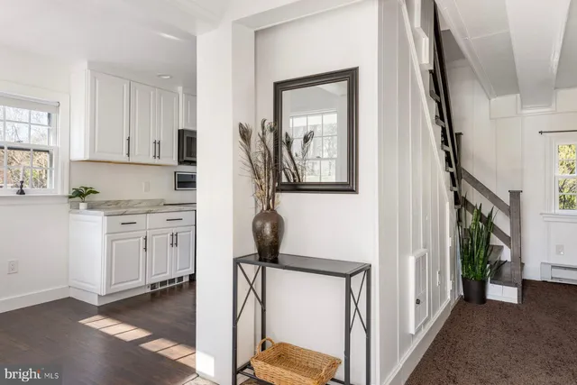 a kitchen with a refrigerator and a sink
