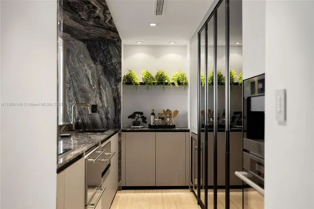 a kitchen with stainless steel appliances a refrigerator and a stove