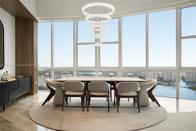 a view of a dining room with furniture and window
