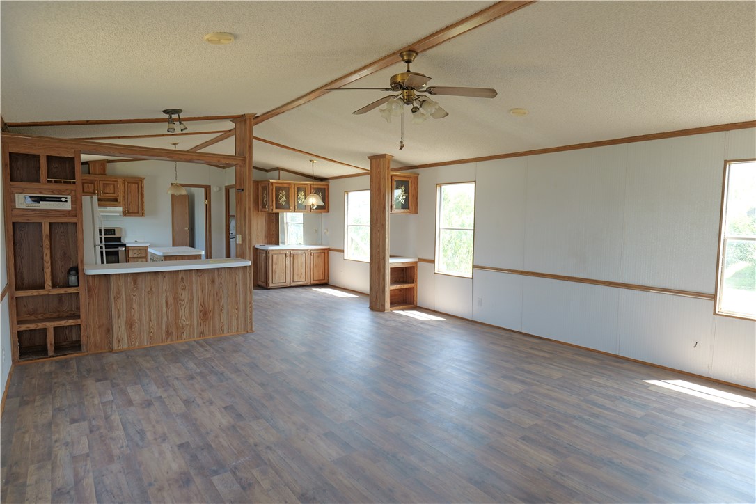 732 A Rogers Street Normangee, TX 77871 - Photo 8 of 8 an empty room with wooden floor and windows
