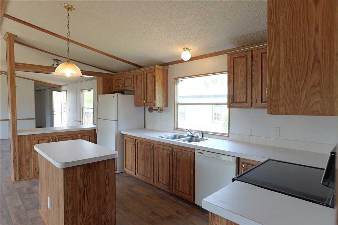 732 A Rogers Street Normangee, TX 77871 - Photo 2 of 8 a kitchen with a sink stove and cabinets