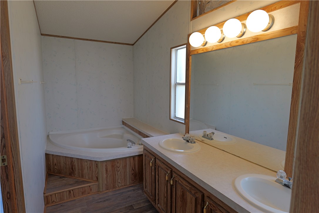 732 A Rogers Street Normangee, TX 77871 - Photo 4 of 8 a bathroom with a sink and mirror