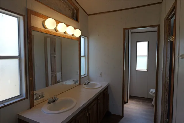 a bathroom with a sink and mirror
