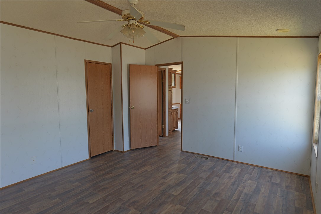 732 A Rogers Street Normangee, TX 77871 - Photo 6 of 8 a view of a storage & utility room with wooden floor