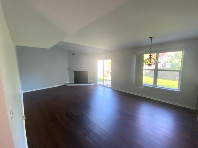 209 North Southport Road Mundelein, IL 60060 - Photo 7 of 18 an empty room with wooden floor and windows