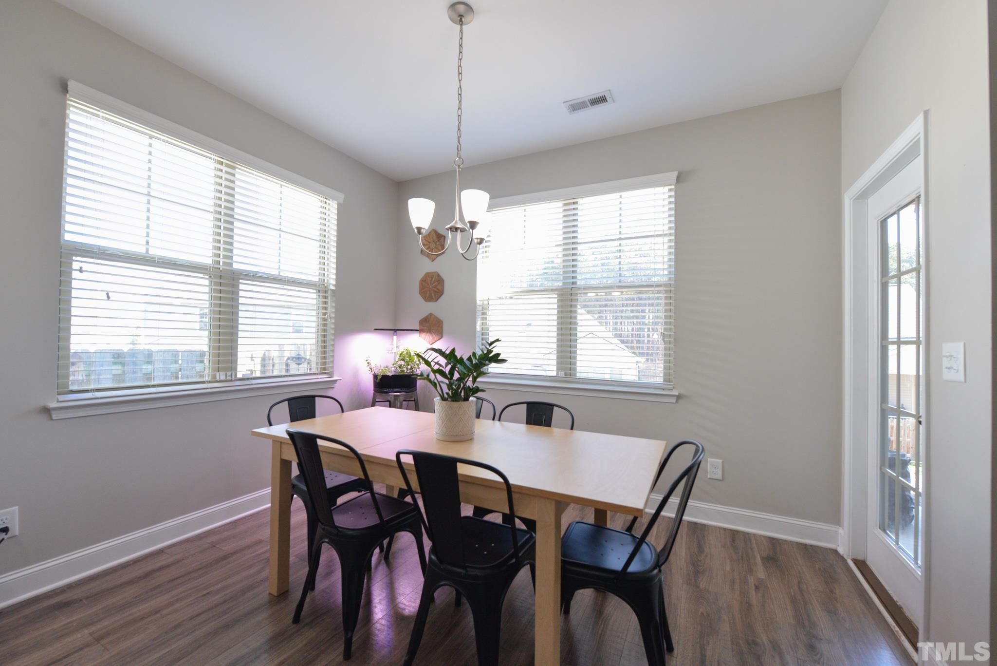 60 Mariners Point Way Garner, NC 27529 - Photo 14 of 43 a view of a dining room with furniture window and wooden floor