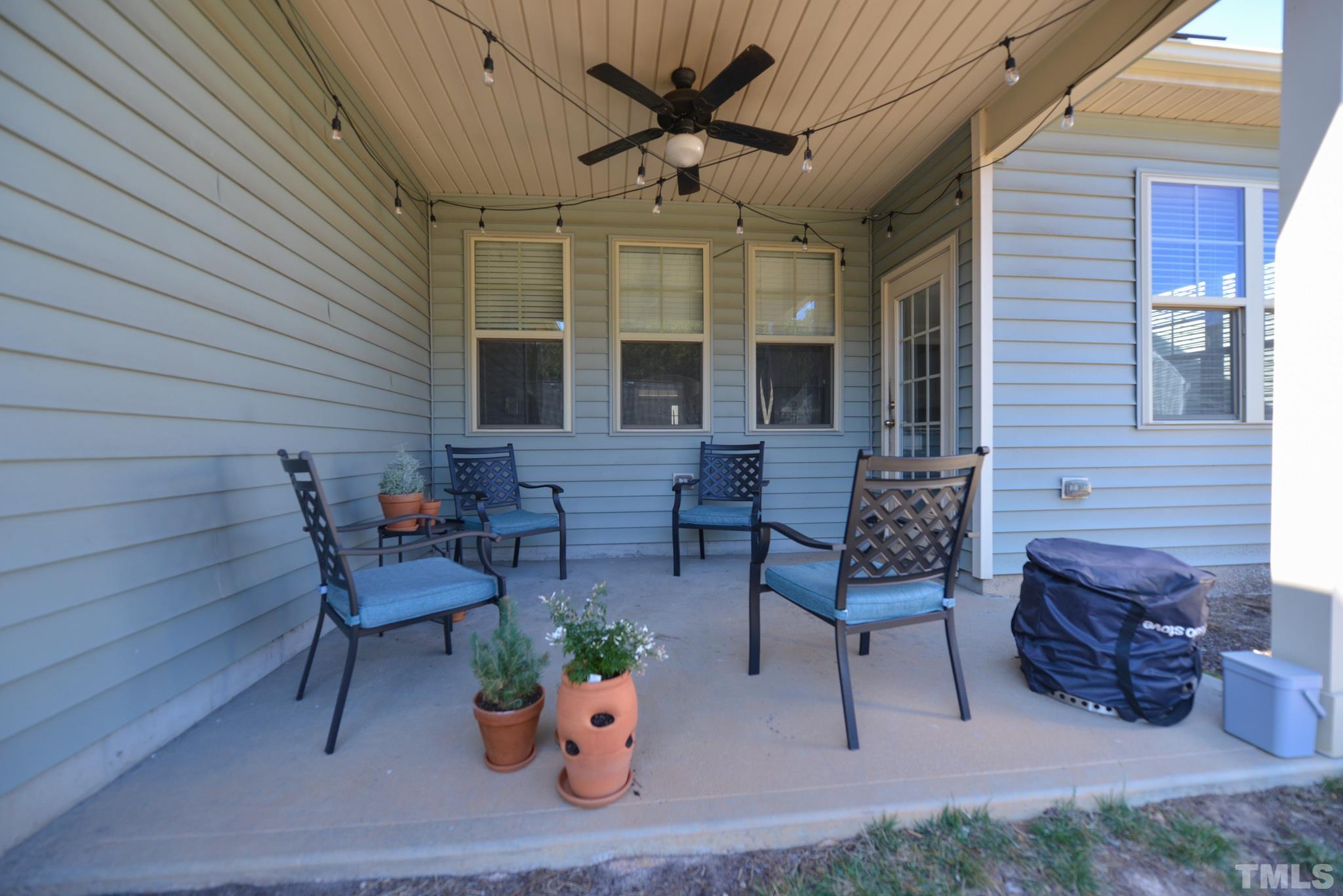 60 Mariners Point Way Garner, NC 27529 - Photo 39 of 43 a view of a patio with couple of chairs and a potted plant