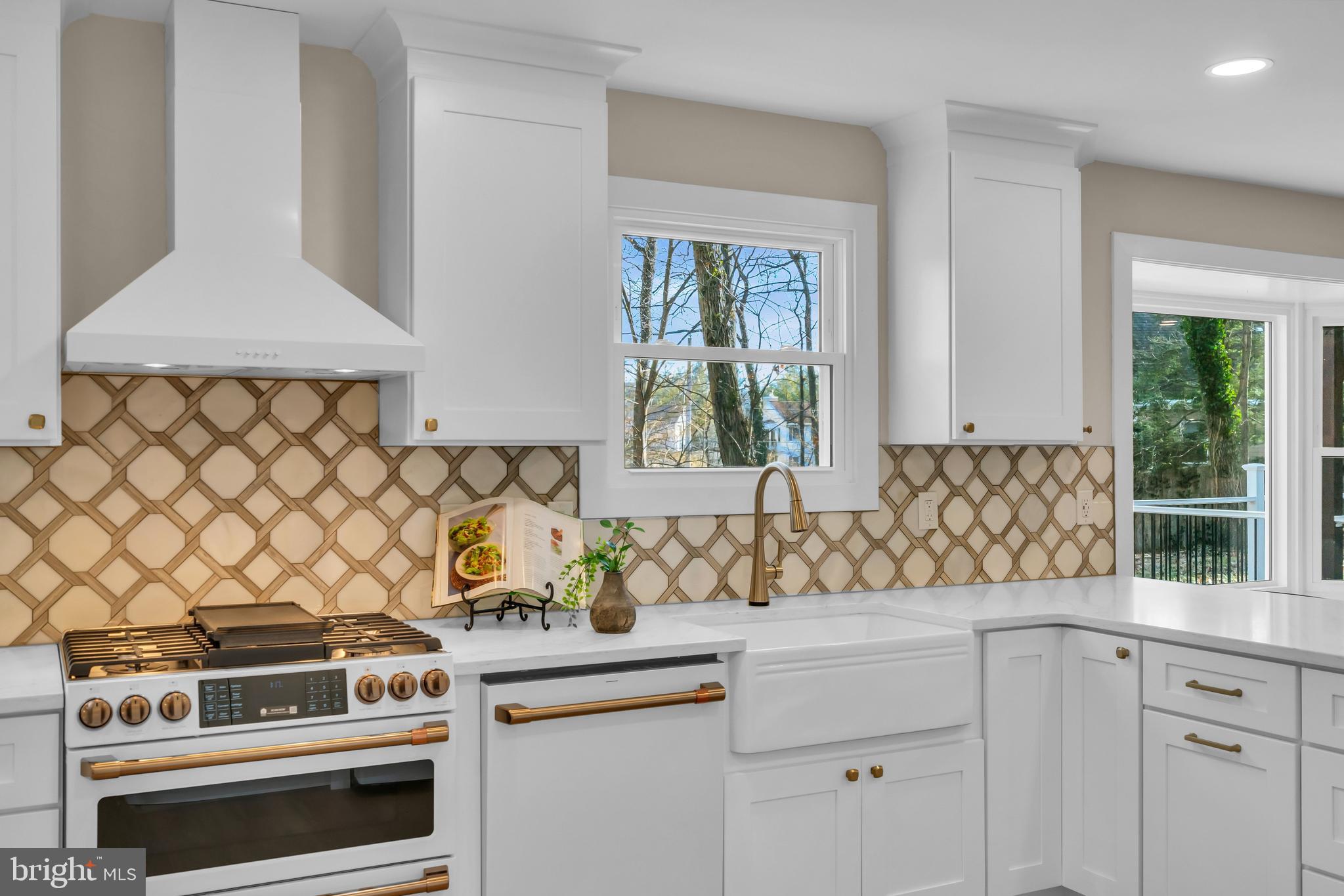 2227 Sand Trap Road Jamison, PA 18929 - Photo 25 of 79 a kitchen with a stove and white cabinets