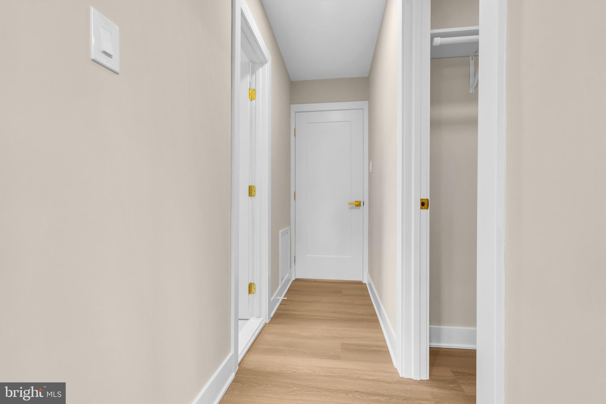 2227 Sand Trap Road Jamison, PA 18929 - Photo 50 of 79 a view of a hallway with wooden floor and staircase