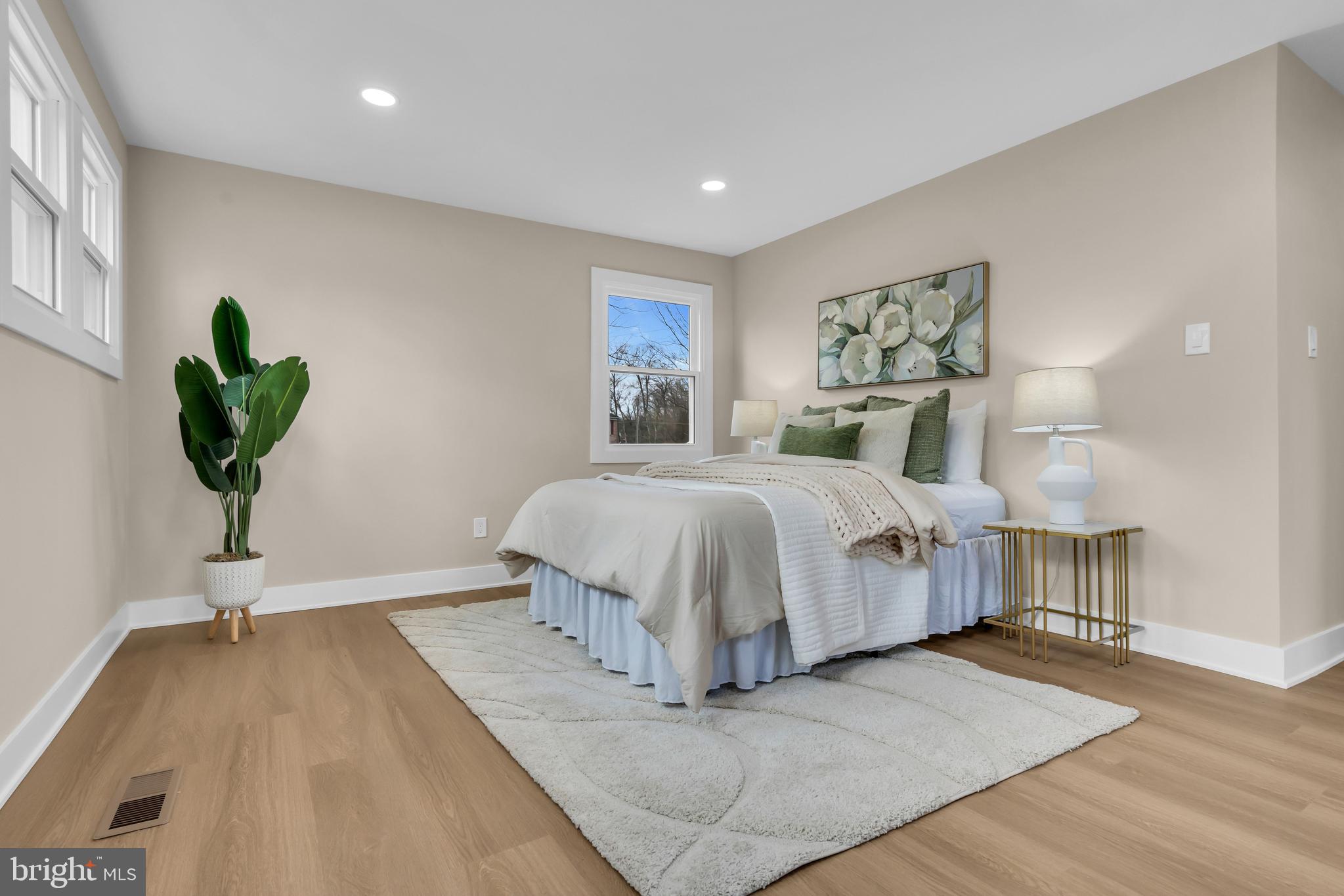 2227 Sand Trap Road Jamison, PA 18929 - Photo 52 of 79 a bedroom with a bed and a painting on the wall