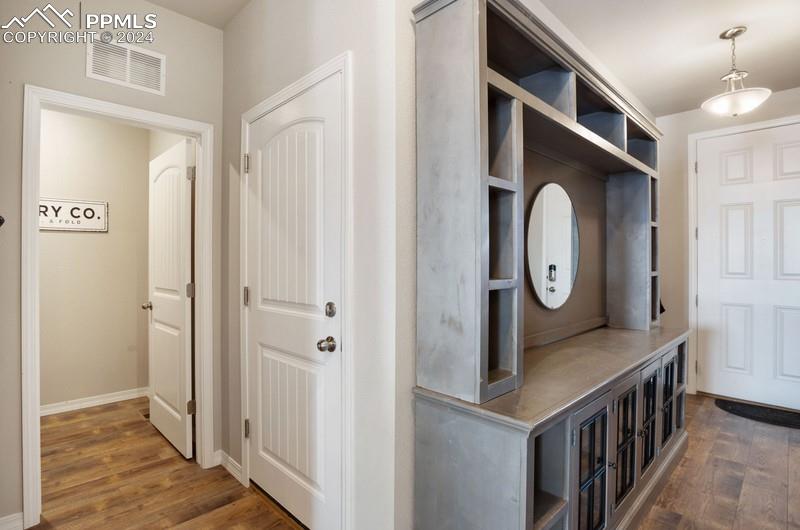 10480 Summer Ridge Drive Peyton, CO 80831 - Photo 5 of 30 a view of a hallway with wooden floor