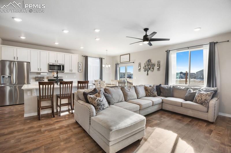 10480 Summer Ridge Drive Peyton, CO 80831 - Photo 8 of 30 a living room with furniture and kitchen view