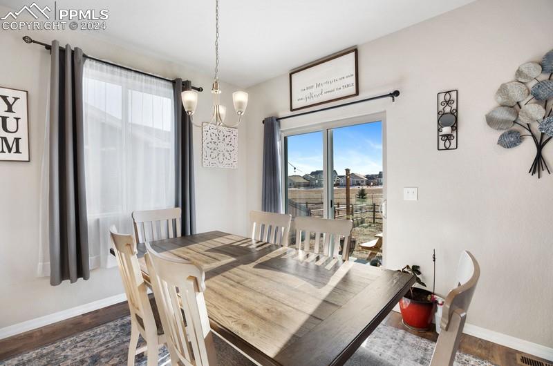 10480 Summer Ridge Drive Peyton, CO 80831 - Photo 10 of 30 a dining room with furniture and window