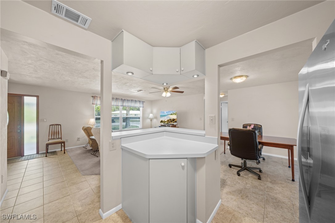 2551 Barcelona Avenue Fort Myers, FL 33905 - Photo 11 of 41 a view of kitchen with furniture and refrigerator