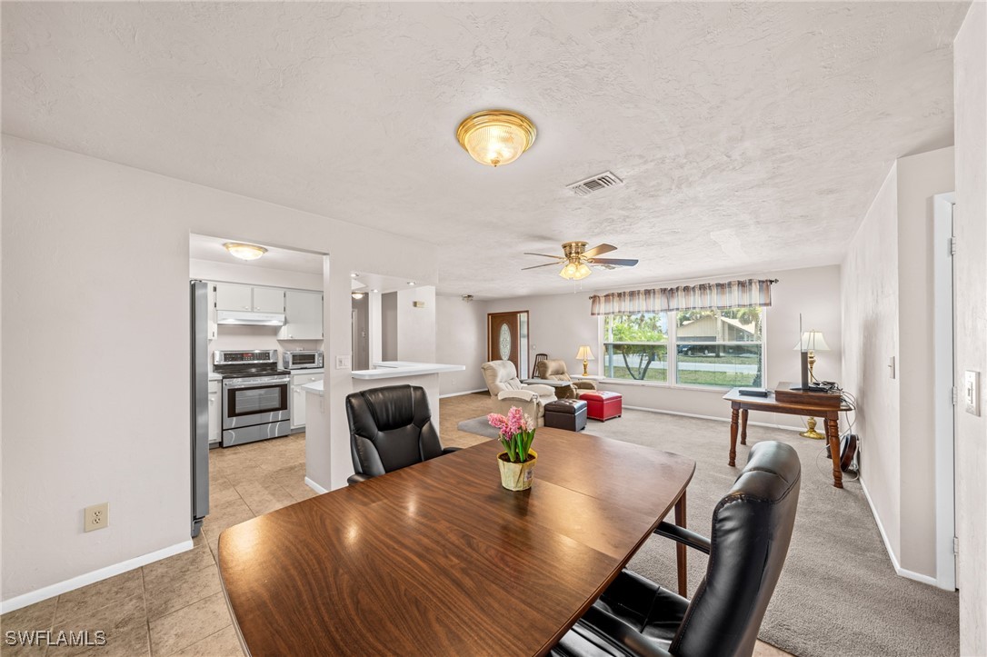 2551 Barcelona Avenue Fort Myers, FL 33905 - Photo 12 of 41 a view of a dining room with furniture and a window