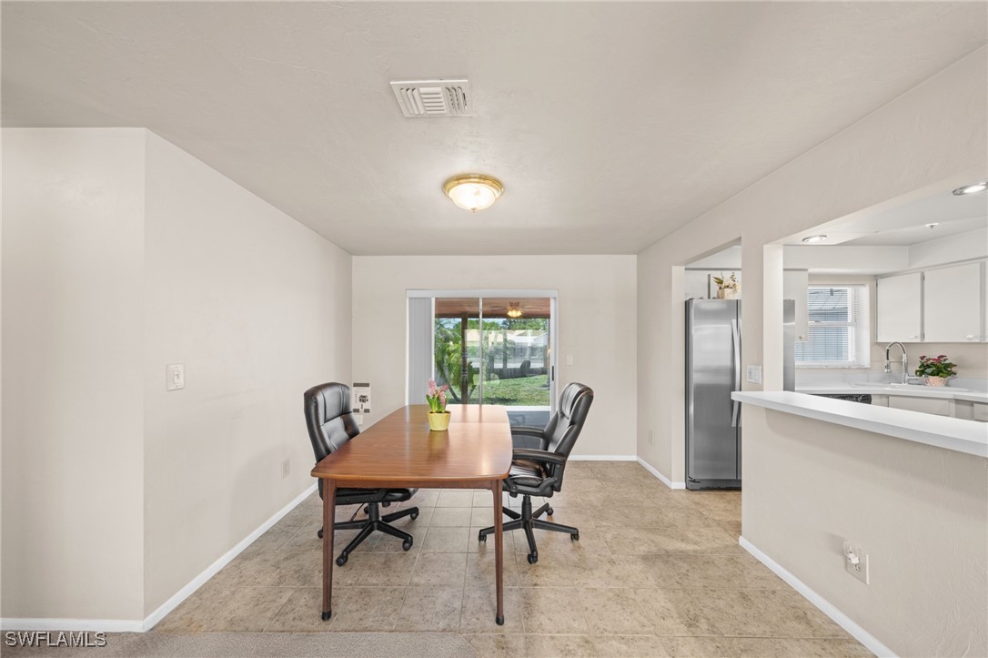 2551 Barcelona Avenue Fort Myers, FL 33905 - Photo 13 of 41 a view of a dining room with furniture and window