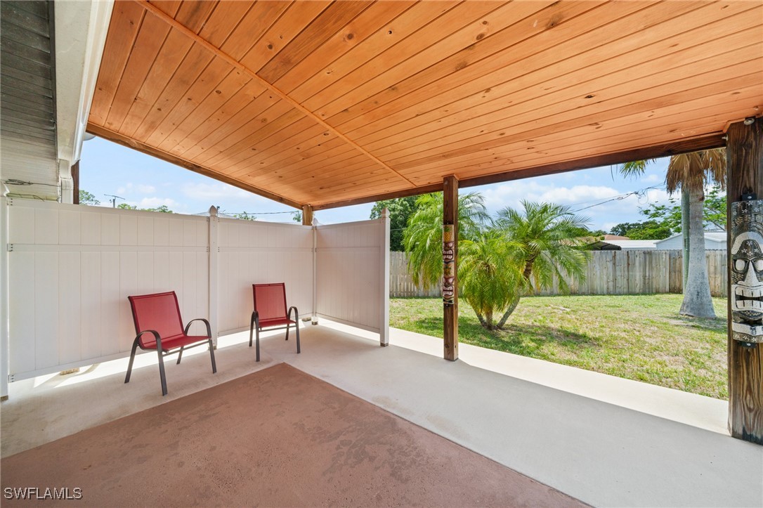 2551 Barcelona Avenue Fort Myers, FL 33905 - Photo 15 of 41 a patio with table and chairs