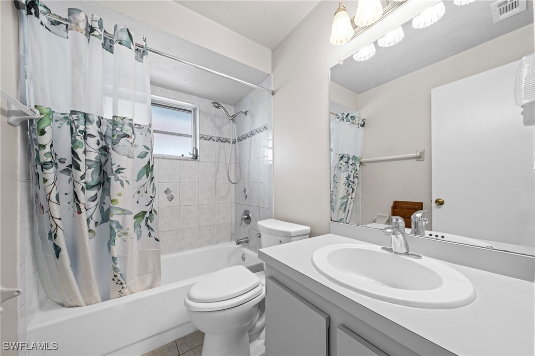 2551 Barcelona Avenue Fort Myers, FL 33905 - Photo 20 of 41 a bathroom with a sink a toilet and shower