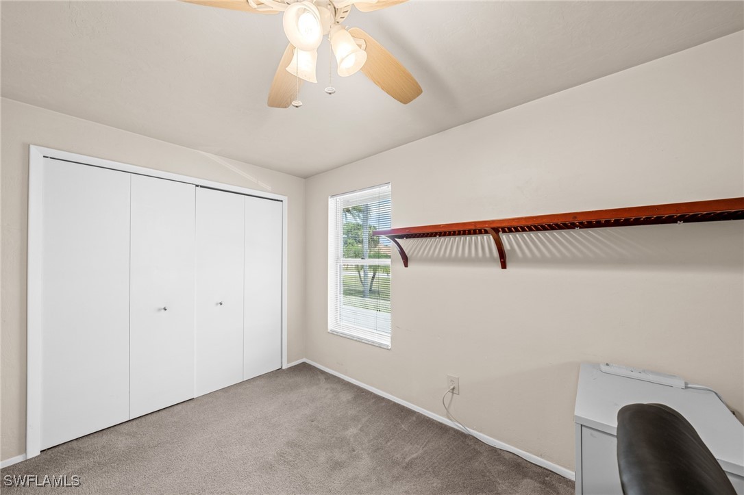 2551 Barcelona Avenue Fort Myers, FL 33905 - Photo 22 of 41 a view of a room with a hanging light and hardwood floor