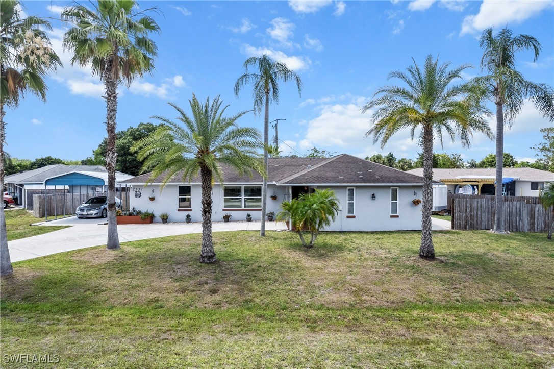 2551 Barcelona Avenue Fort Myers, FL 33905 - Photo 37 of 41 a house with palm tree in front of it