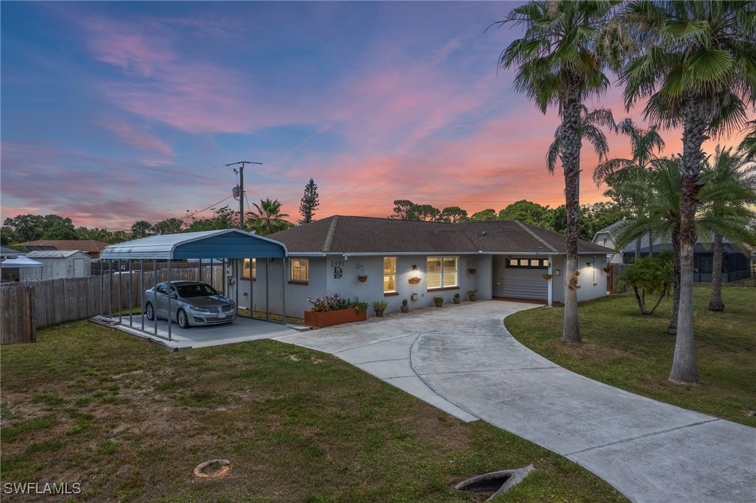 2551 Barcelona Avenue Fort Myers, FL 33905 - Photo 38 of 41 a front view of a house with garden