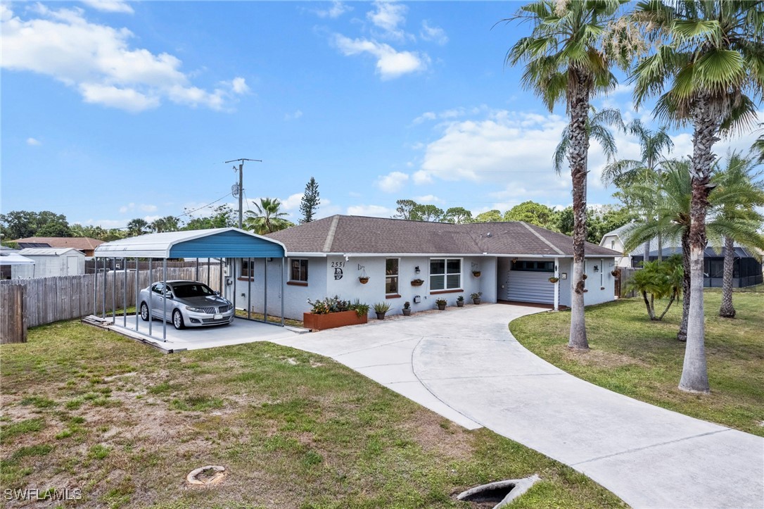 2551 Barcelona Avenue Fort Myers, FL 33905 - Photo 40 of 41 a swimming pool view with a garden